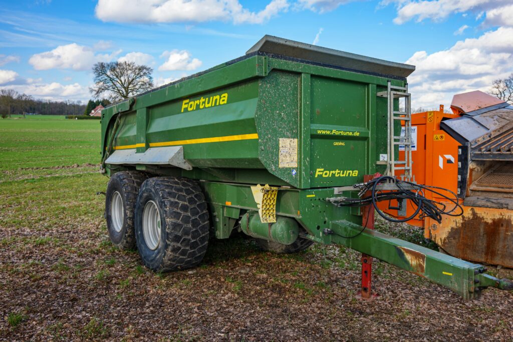 Green Fortuna trailer parked in a field, Coesfeld, Germany.